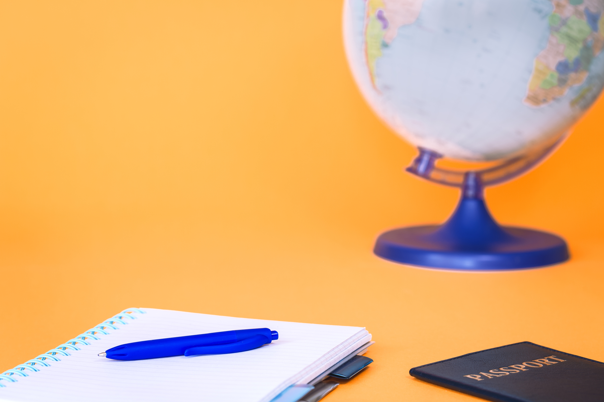 Passport, globe and notebook. Travel concept